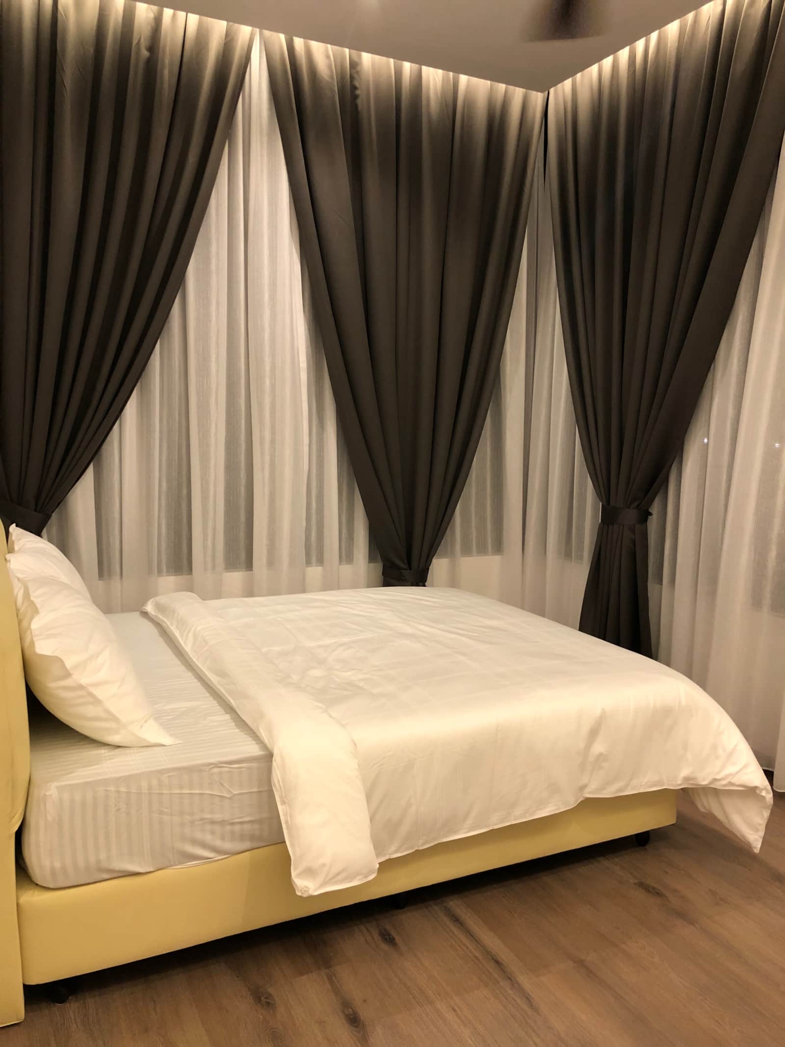 Bedroom with floor-length curtains